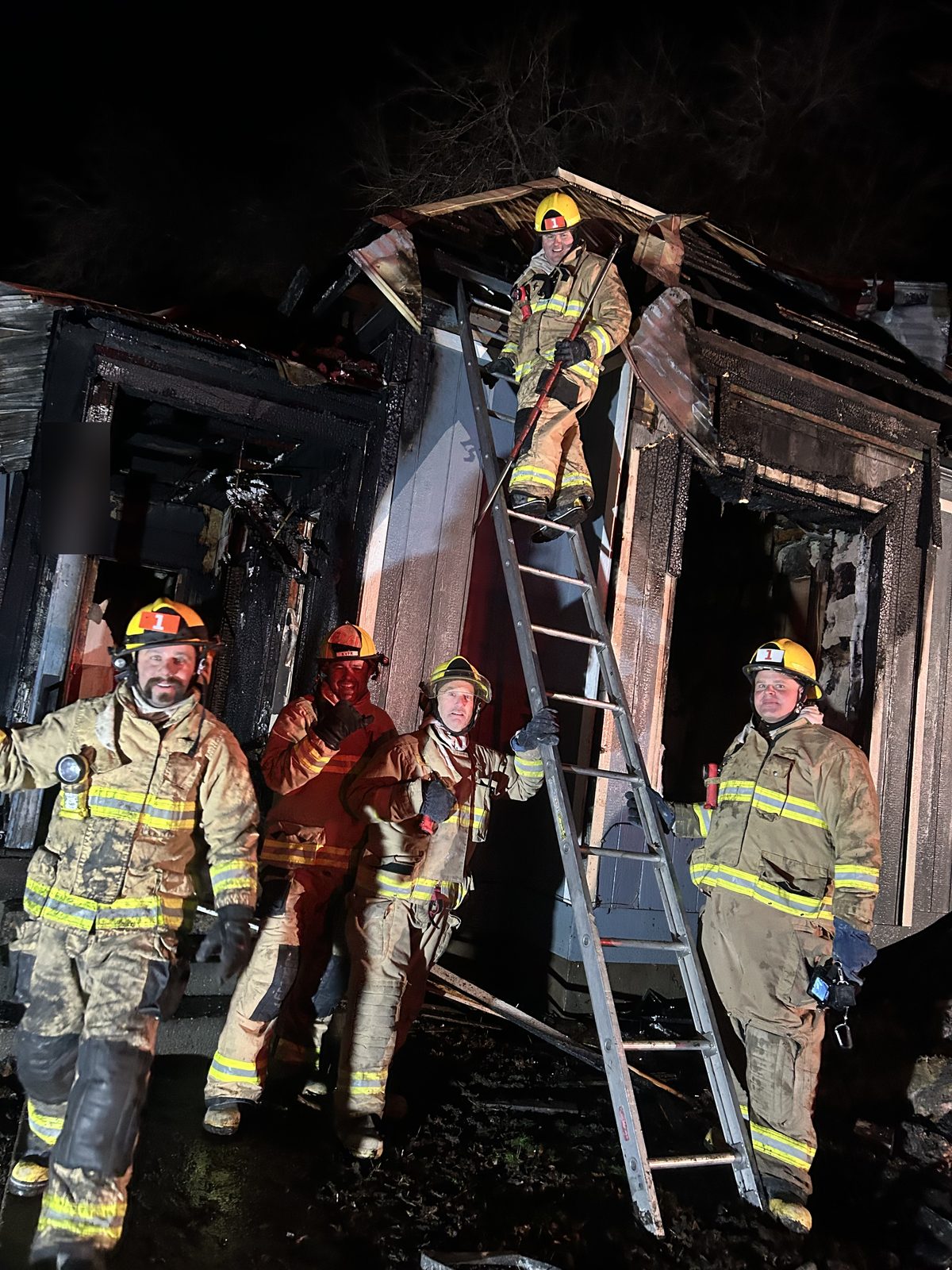 KVVFA volunteer firefighters at the scene of a structure fire at night